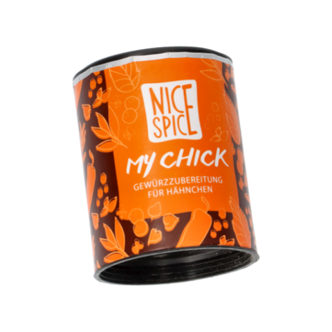 NICE SPICE My Chick Gewürzzubereitung für Hähnchen in oranger zylinderförmiger Dose mit verspieltem Design perspektivisch